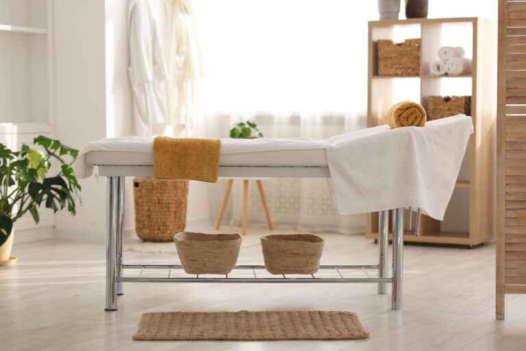 comfortable massage table with clean towels spa center